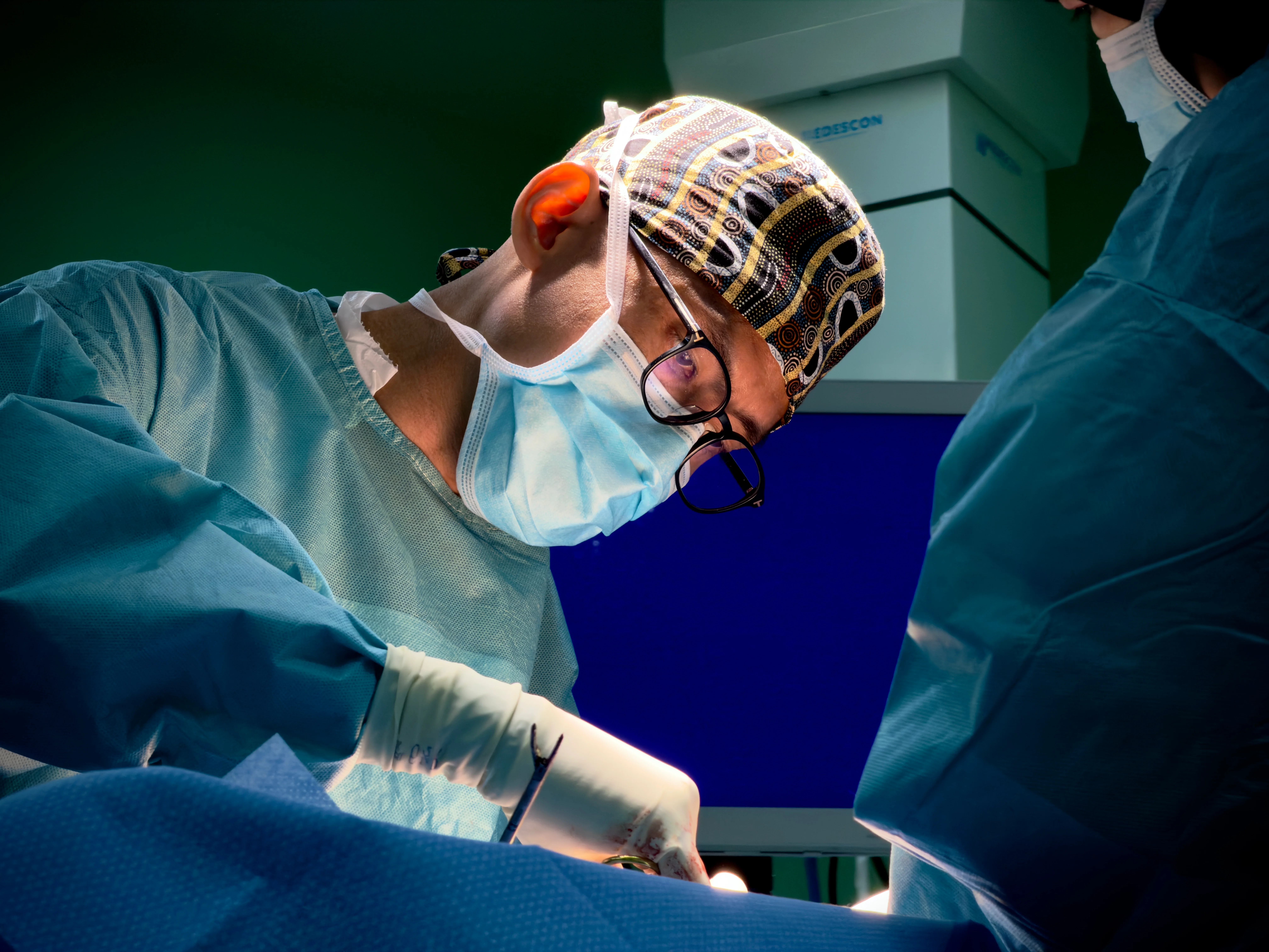 Dr. Nik Qisti Fathi performing surgery in the operating theatre at KPJ Kajang Specialist Hospital